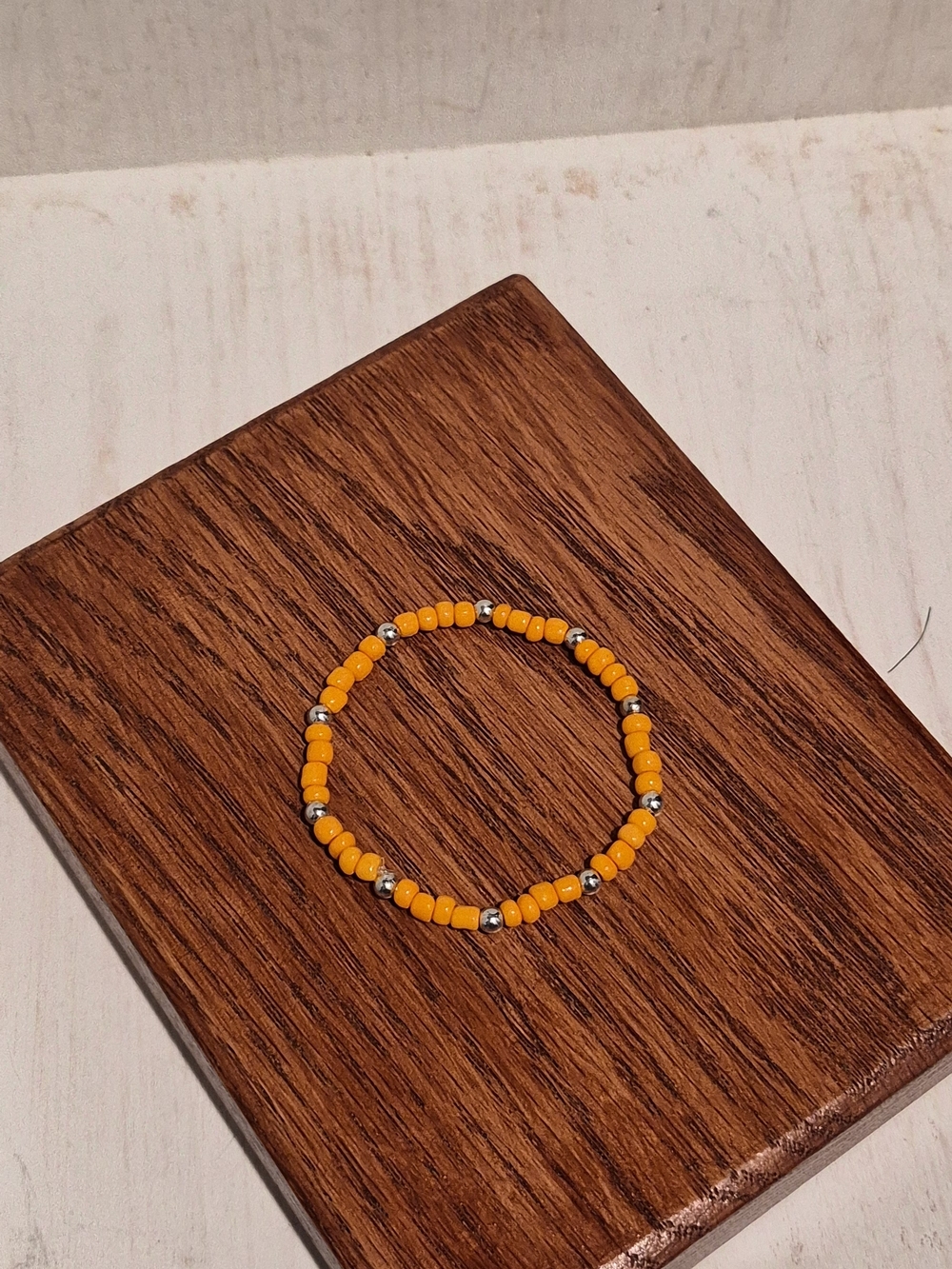 Orange Beaded Stretch Bracelet with Silver Accents - Beautiful Victory